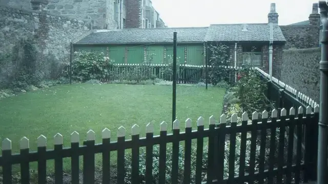 A shared back court behind granite tenements in Rosemount, Aberdeen