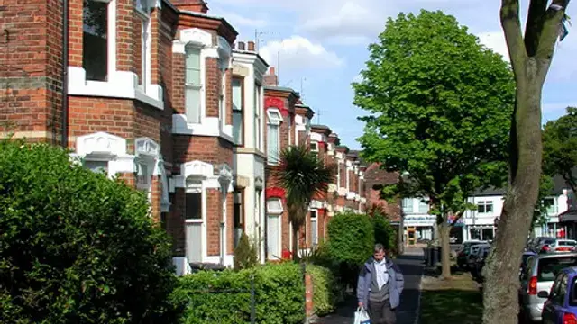 A long terraced row on Ella Street in Hull, with cars parked along both kerbs